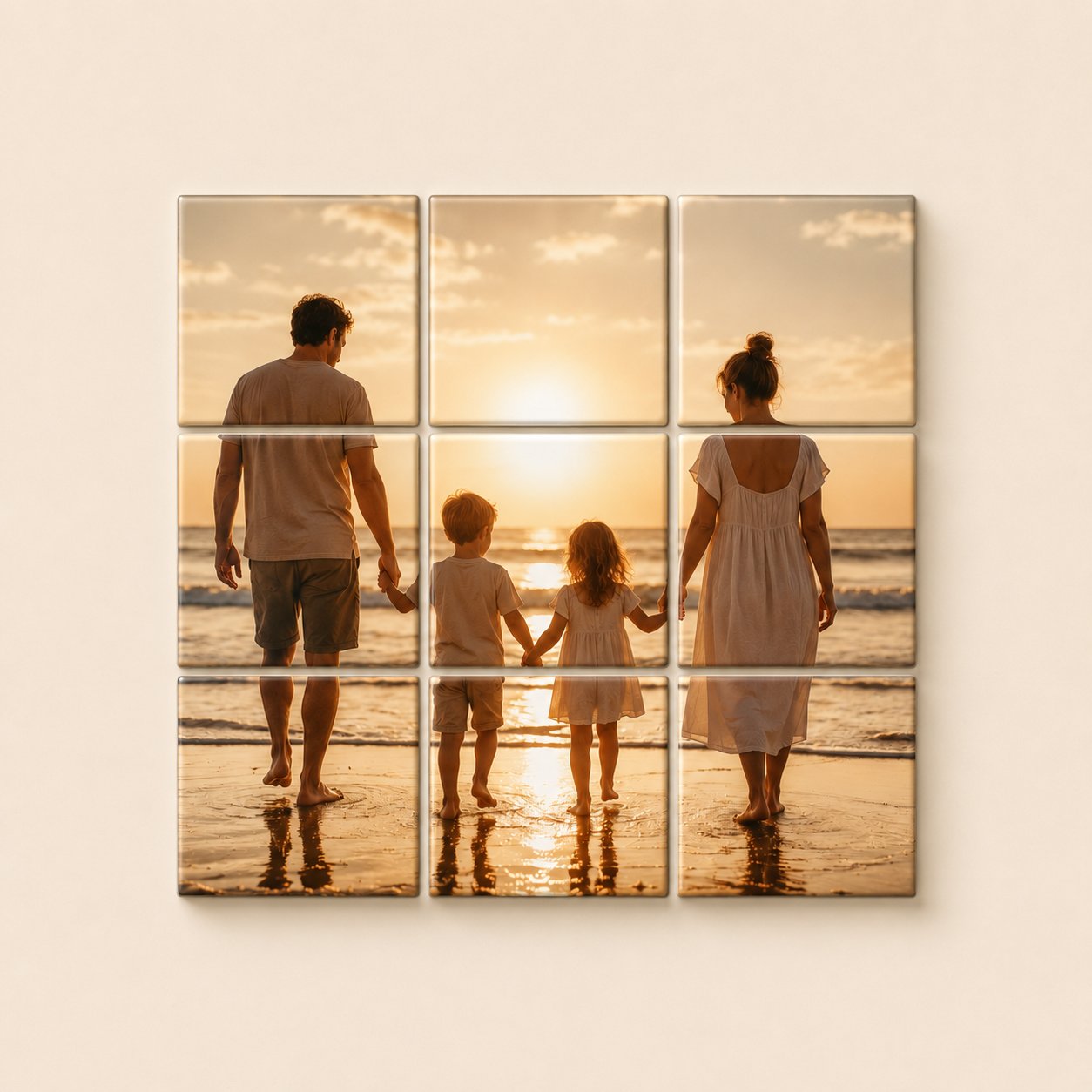 9-tile photo mosaic of a family at sunset on the beach, displayed on a cream living room wall